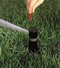 a sprinkler head adjustment with a special hunter irrigation key